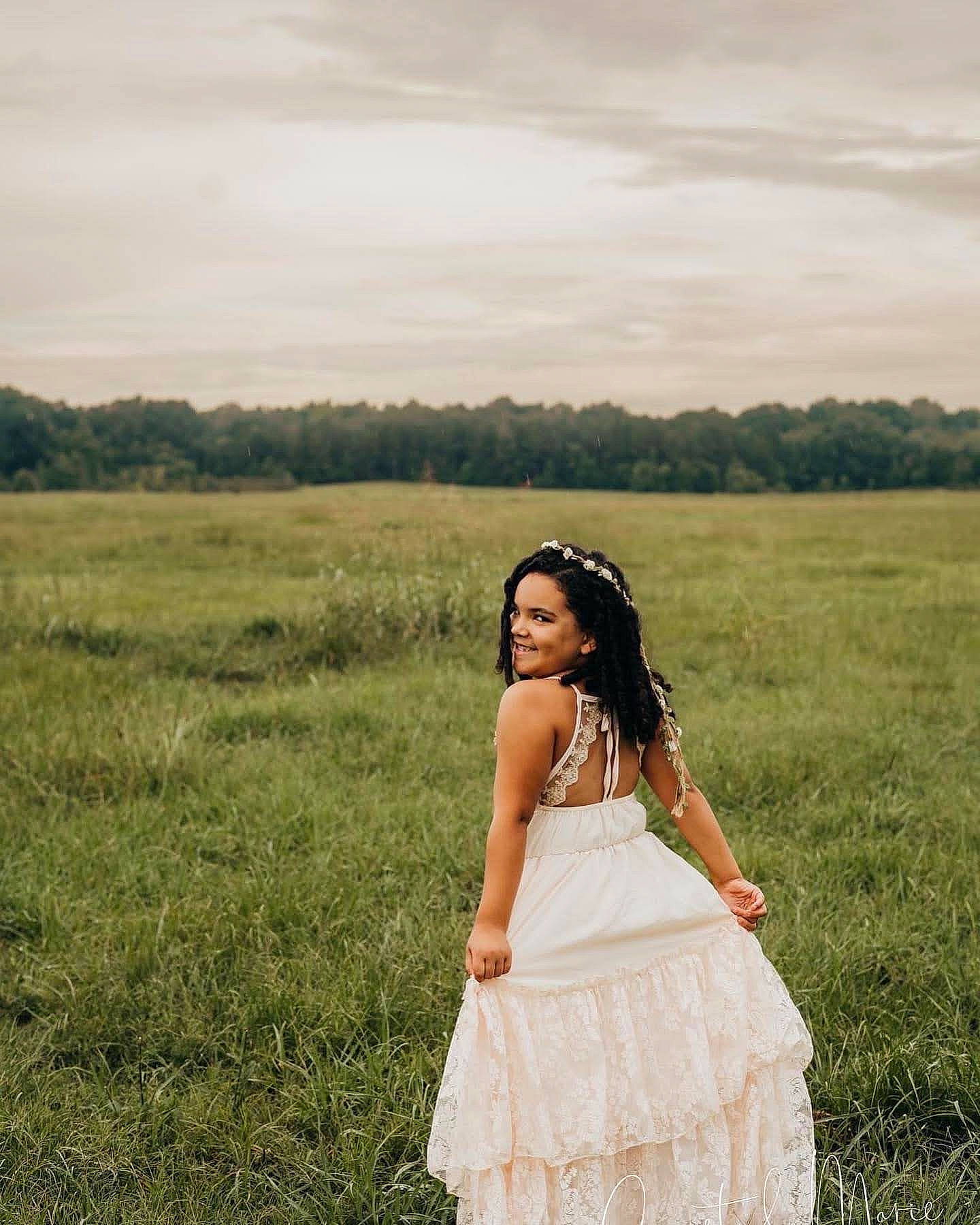 Zailee is registered to the contest to win money with this photo: black_hair, bridal_clothing, cloud, dress, ecoregion, flash_photography, grass, happy, joy, landscape, morning, natural_environment, nature, people_in_nature, person, plant, shoulder, sky, sunlight, tree