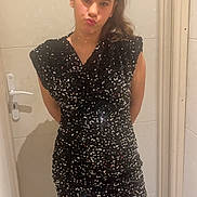 Zoe participe au concours pour gagner de l'argent avec cette photo : girl, child, pose, sparkly_dress, sequins, black_dress, standing, hallway, door, mirror, reflection, playful, duck_face, long_hair, casual, indoor, fashion, portrait, legs, tights