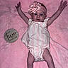 baby, infant, pink_blanket, headband, flower, two_months_sign, arms_up, striped_outfit, cute, newborn, lying_down, milestone, soft_texture, child, portrait, baby_clothes, happy, small_hands, baby_face, celebration