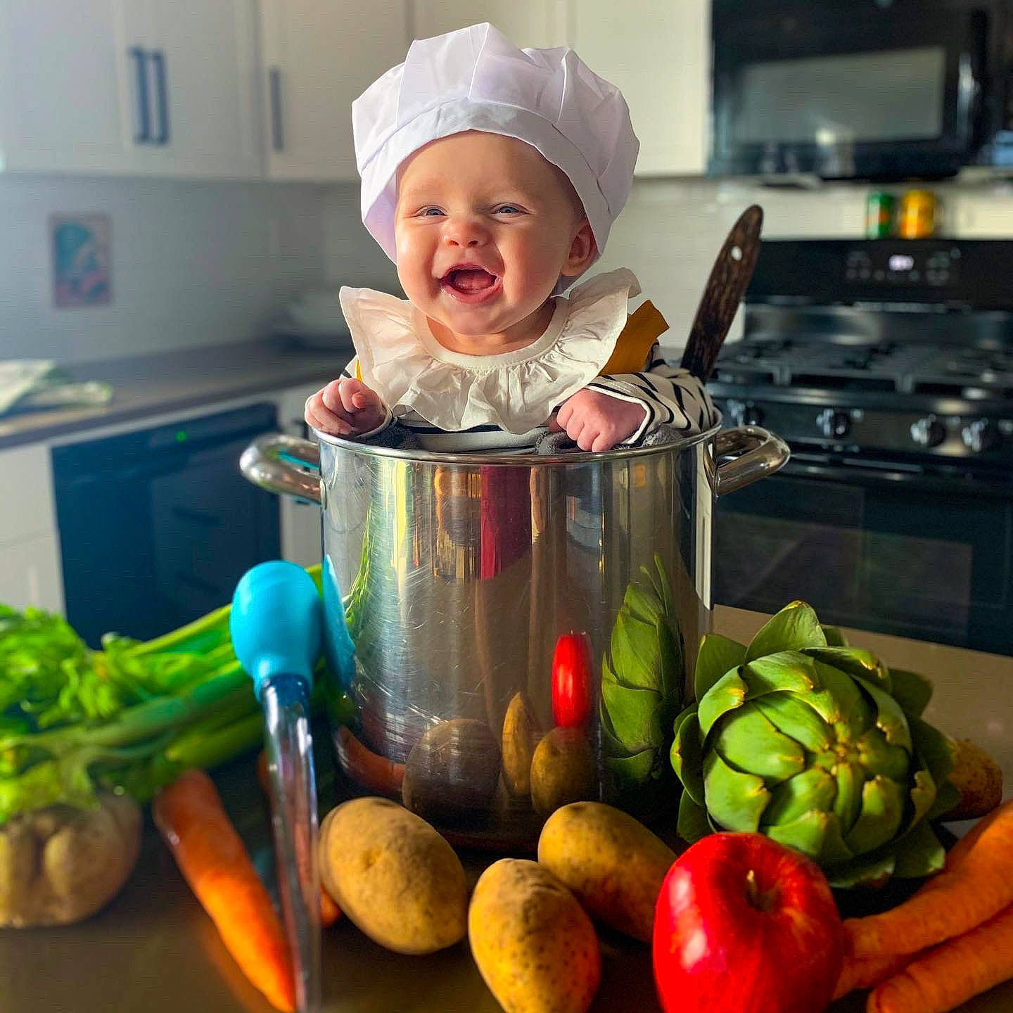 Brinley is registered to the contest to win money with this photo: asparagus, chef, child, cook, cooking, cruciferous_vegetables, cuisine, dish, food, fruit, headwear, kitchen, leaf_vegetable, local_food, person, plant, produce, recipe, smile, vegetable