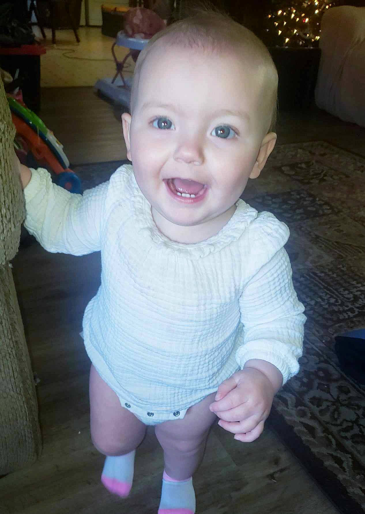 Laney joined the competition — help win amazing prizes! baby, baby_toddler_clothing, cheek, chin, eye, flooring, hair, hairstyle, head, human_body, iris, lip, mouth, nose, organ, person, skin, sleeve, smile, thumb