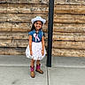 Aiza Grenevitch joined the competition — help win amazing prizes! child, girl, smiling, cowboy_hat, cowgirl, denim_dress, pink_ribbon, western_style, cowboy_boots, standing, portrait, outdoor, wooden_wall, rustic, fashion, happy, long_hair, full_body, concrete_floor, photography