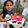 child, birthday, birthday_cake, cowboy_hat, smiling, girl, outdoor, party, celebration, pink, cake, number_six, candles, dessert, family, park, table, disco_ball, denim, portrait