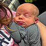 Wilson is registered to the contest to win money with this photo: baby, newborn, sleeping, blanket, person, arm, clothing, indoor, face, peaceful, cute, child, resting, closeup, human, toddler, portrait, skin, head, comfort