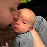 Wilson joined the competition — help win amazing prizes! baby, newborn, person, face, kiss, affection, closeup, holding, love, child, sleepy, indoor, clothing, head, skin, arm, portrait, expression, care, tenderness