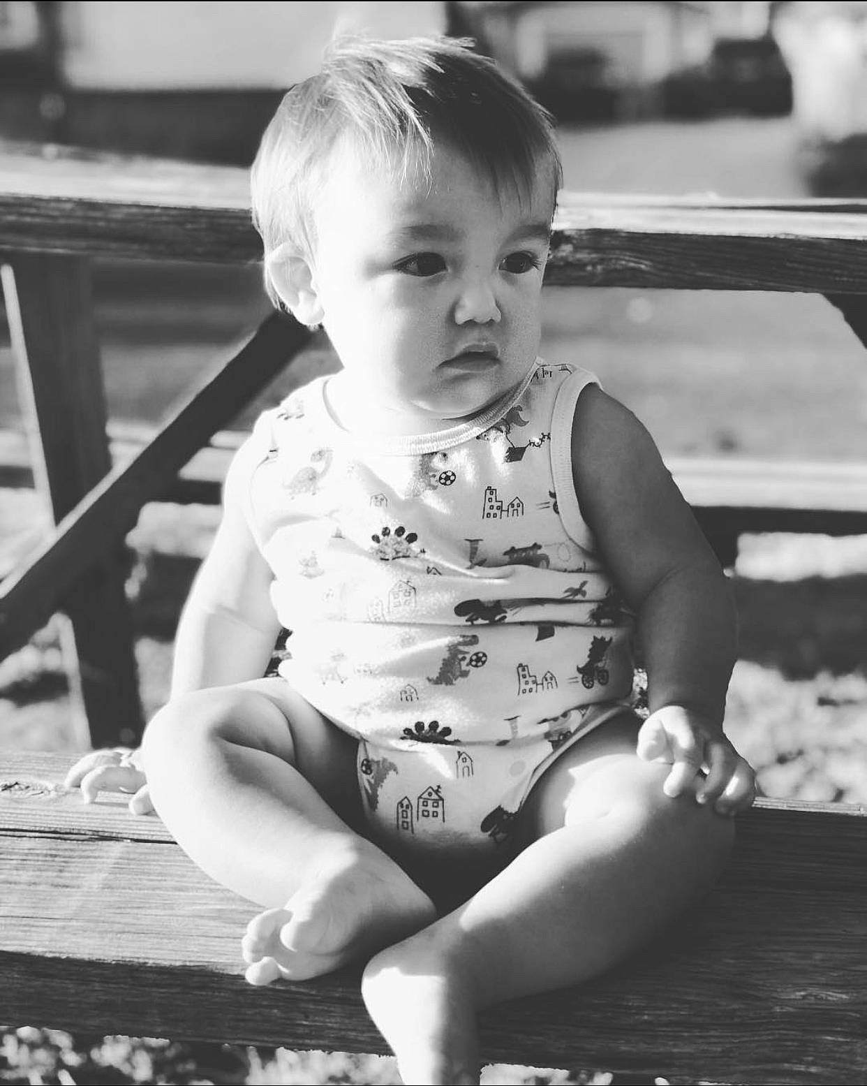August is registered to the contest to win money with this photo: baby_toddler_clothing, black, black_and_white, child, face, facial_expression, flash_photography, fun, hairstyle, hand, happy, iris, monochrome, monochrome_photography, person, photograph, smile, standing, style, toddler