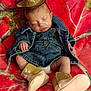 Oakleigh is registered to the contest to win money with this photo: adorable, baby, blanket, boots, child, clothing, cowboy_hat, cute, denim_jacket, footwear, hat, indoor, infant, overalls, peaceful, portrait, resting, sleeping, soft, young