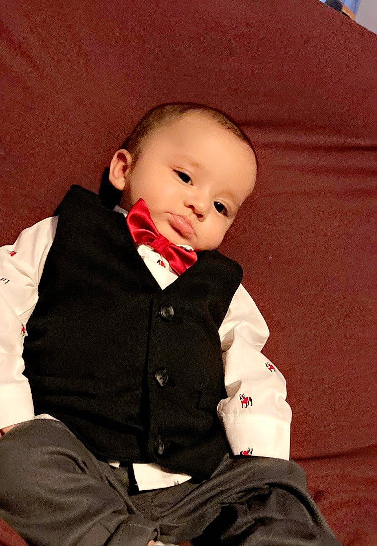 Eugene is registered to the contest to win money with this photo: baby, baby_toddler_clothing, button, cheek, child, collar, comfort, person, sitting, sock, toddler
