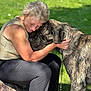 Waldo joined the competition — help win amazing prizes! woman, dog, hug, outdoor, grass, pet, friendship, love, affection, animal, canine, leash, casual_clothing, smile, nature, sunlight, close_up, bond, relaxation, friend