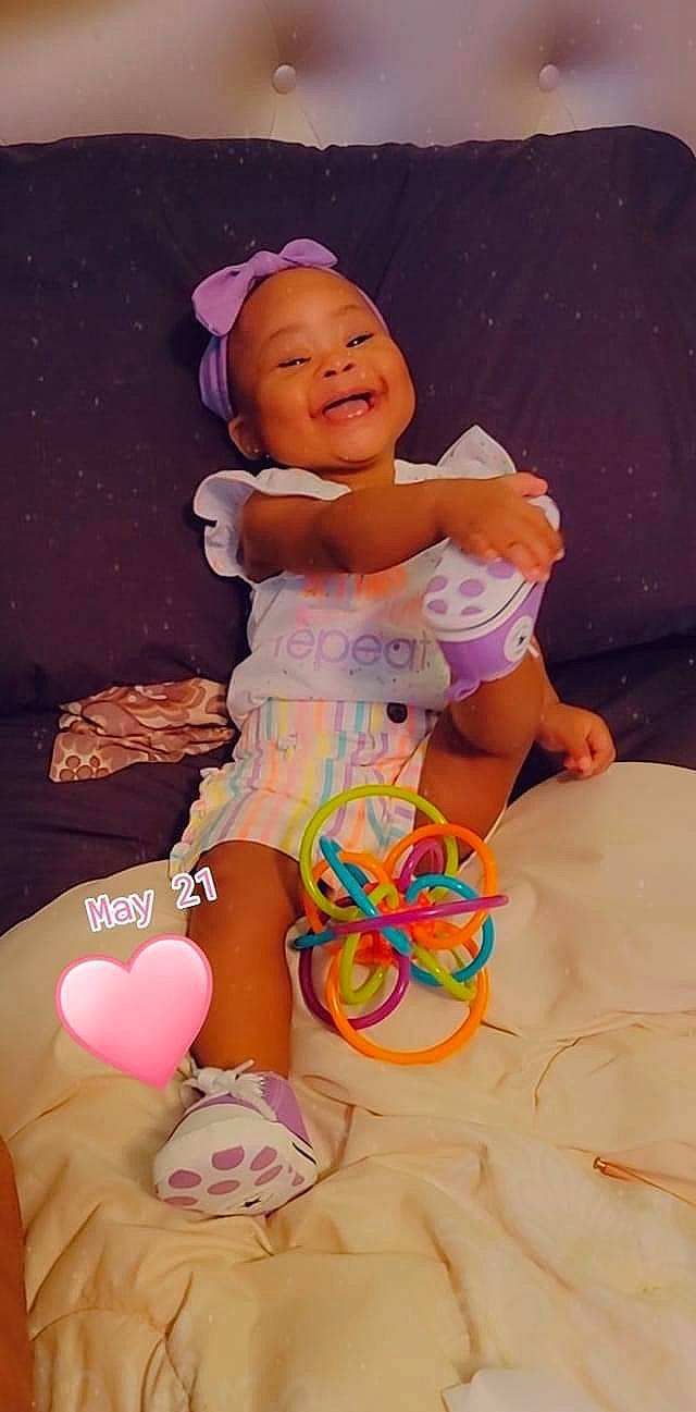 Taisley Reign joined the competition — help win amazing prizes! baby, baby_playing_with_toys, baby_toddler_clothing, birthday, child, finger, fun, happy, hat, human_leg, magenta, party_supply, person, pink, play, purple, sitting, smile, thigh, thumb