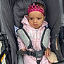 baby, child, clothing, cute, gray, headwear, hoodie, infant, outdoor, person, pink, plush_toy, portrait, safety_harness, seatbelt, serious_face, sitting, stroller, tiara, young_child