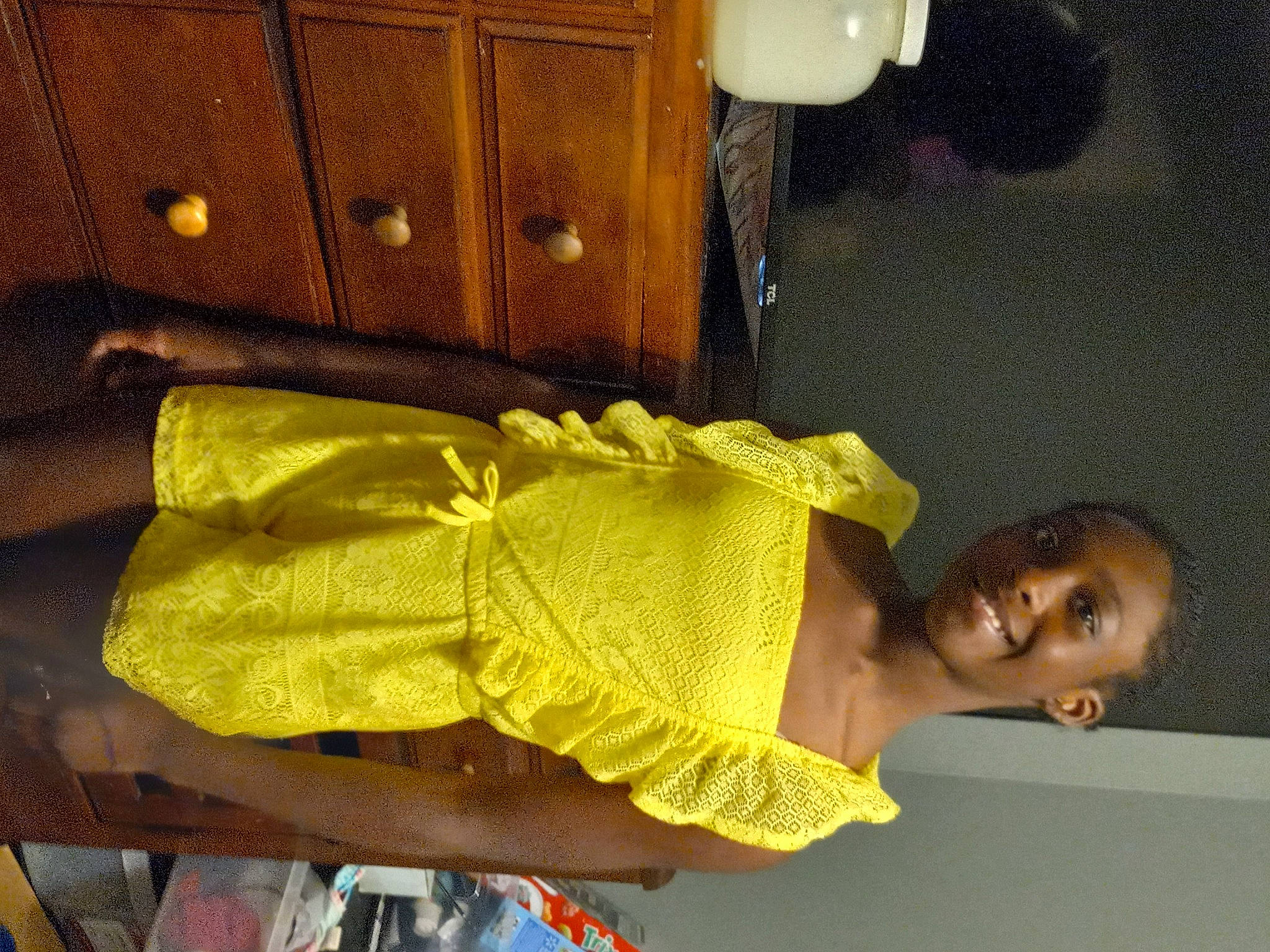 Zora is registered to the contest to win money with this photo: abdomen, bag, cabinetry, chest_of_drawers, cupboard, drawer, elbow, fashion_design, fun, human_leg, joy, pattern, person, room, sari, sleeve, smile, thigh, trunk, waist