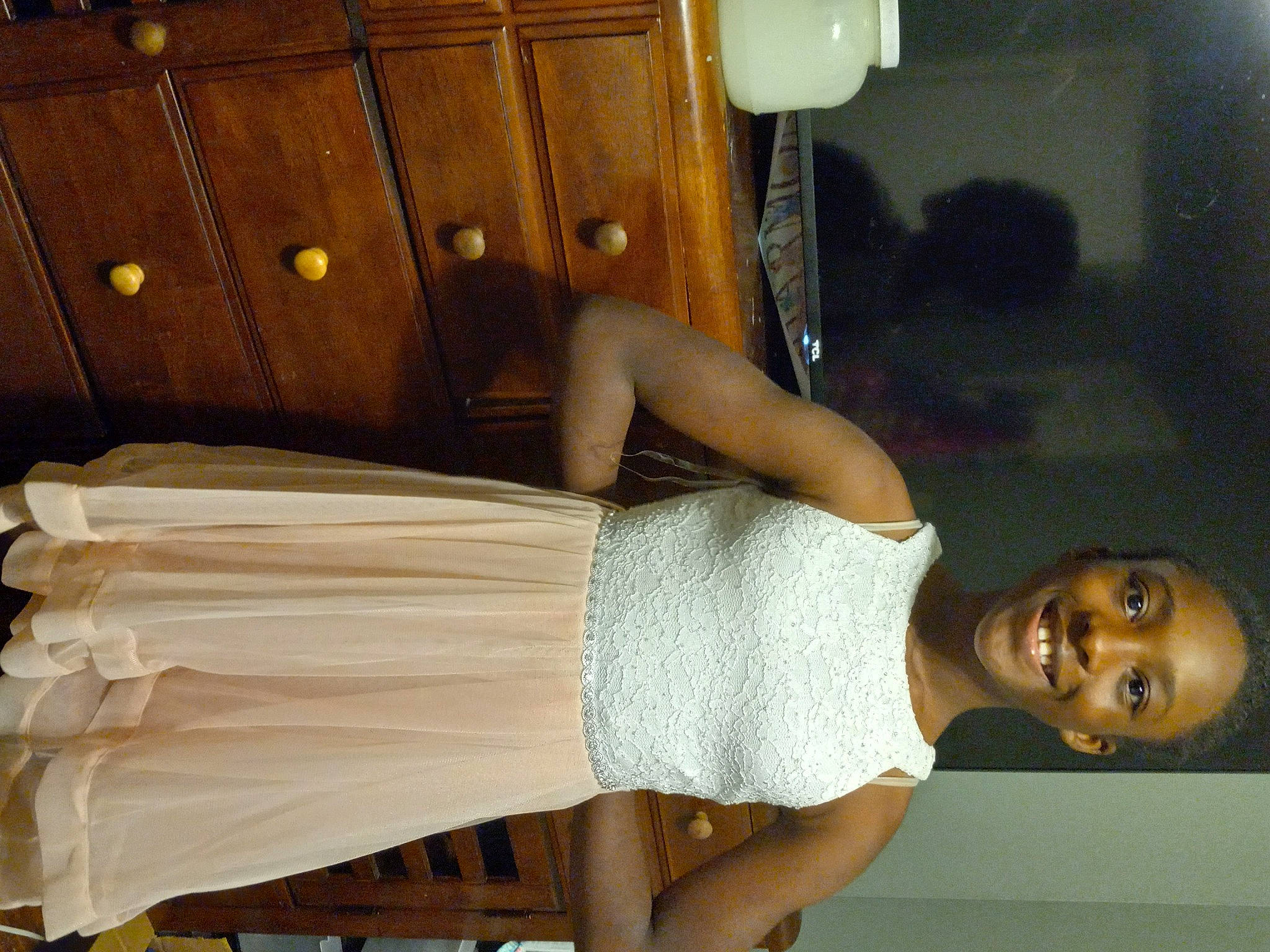 Zora is registered to the contest to win money with this photo: arm, cabinetry, chest, drawer, elbow, fun, head, human_body, human_leg, joint, joy, lighting, muscle, person, room, shoulder, smile, thigh, trunk, waist