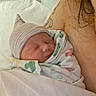 Michael joined the competition — help win amazing prizes! newborn, baby, infant, sleeping, swaddled, hat, blanket, portrait, indoors, bed, adult, shoulder, parent, cozy, peaceful, face, closed_eyes, striped_hat, nursery, family