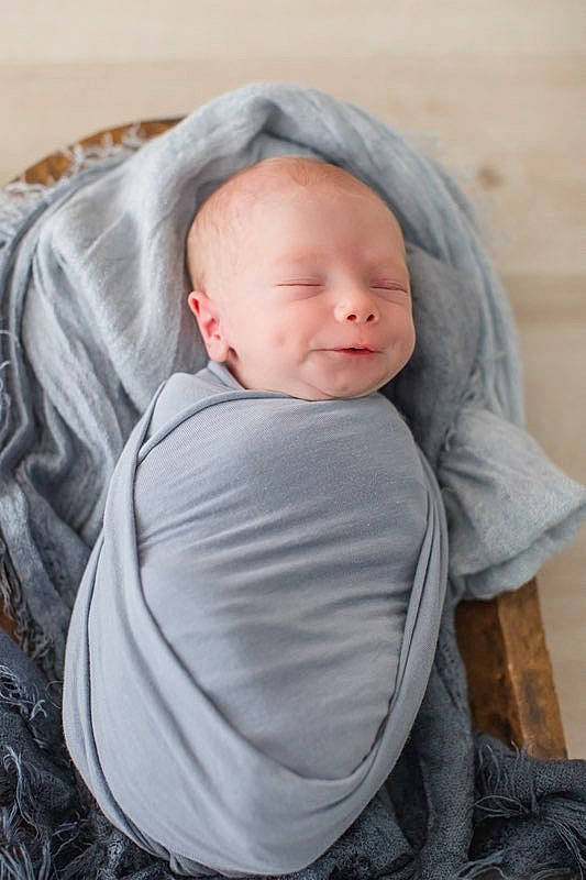 Roysden is registered to the contest to win money with this photo: baby, baby_products, baby_toddler_clothing, cheek, child, chin, comfort, eye, grass, grey, happy, hoodie, linens, person, portrait_photography, sitting, skin, sleeve, toddler, tree