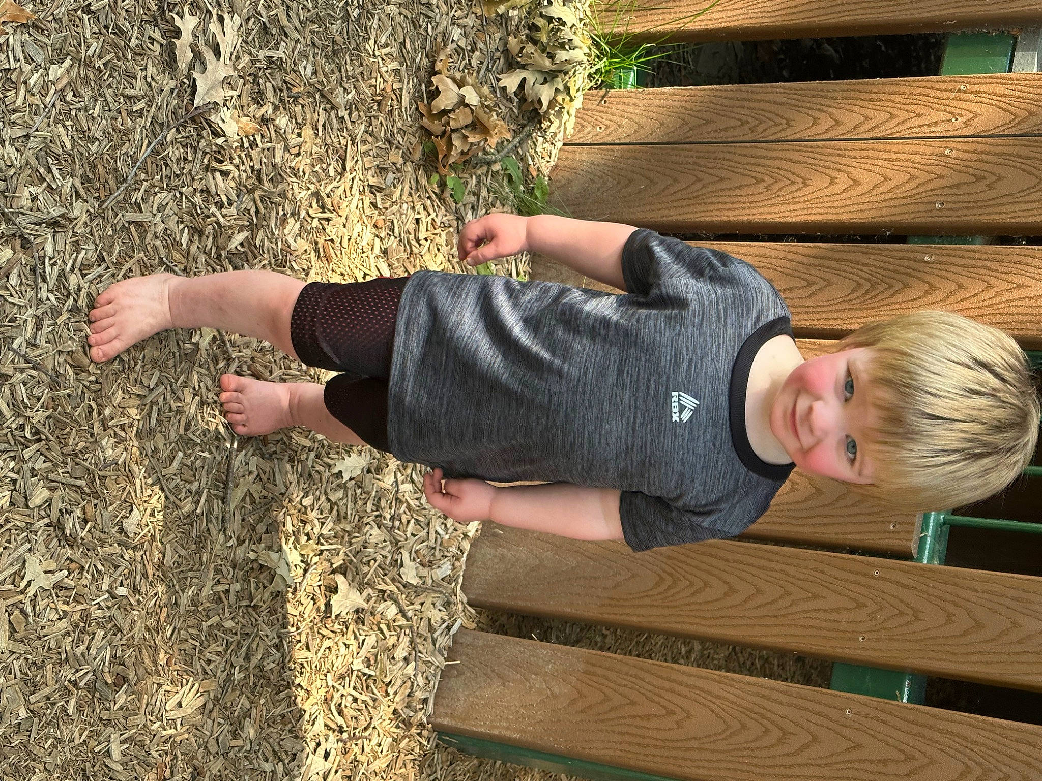 Carter joined the competition — help win amazing prizes! child, denim, foot, fun, grass, hardwood, human_leg, joy, leisure, people_in_nature, person, plant, shadow, sitting, soil, t_shirt, toddler, tree, trunk, vacation