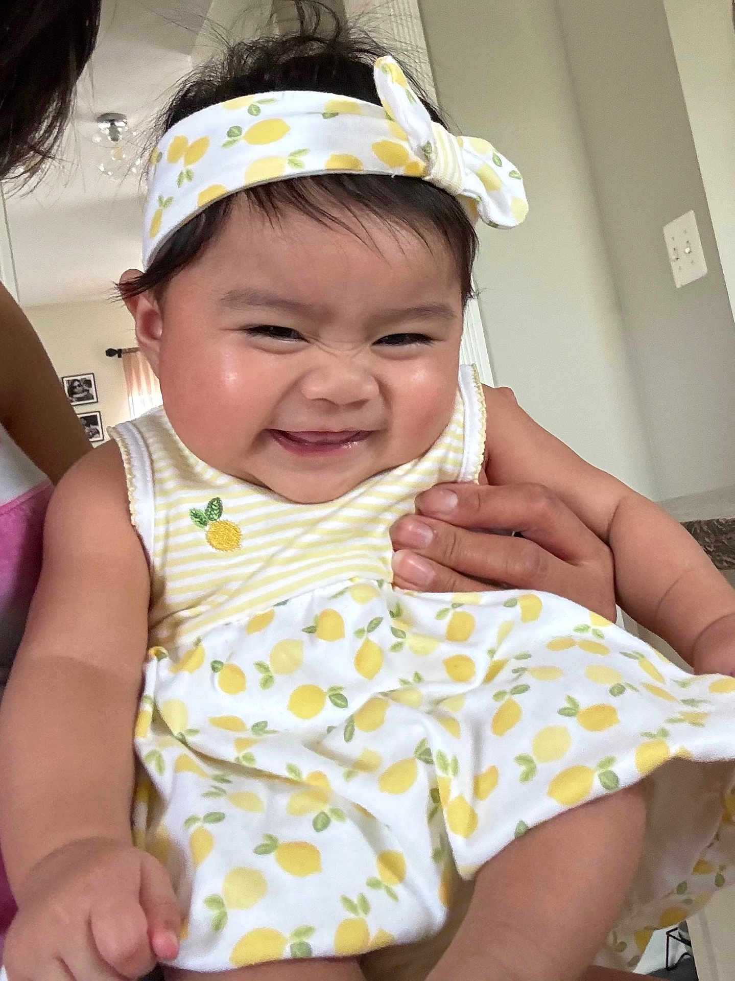 Mariko Kaimo joined the competition — help win amazing prizes! baby, child, smiling, headband, dress, pattern, yellow, white, hand, indoor, person, cute, happy, skin, face, cheeks, holding, infant, clothing, toddler