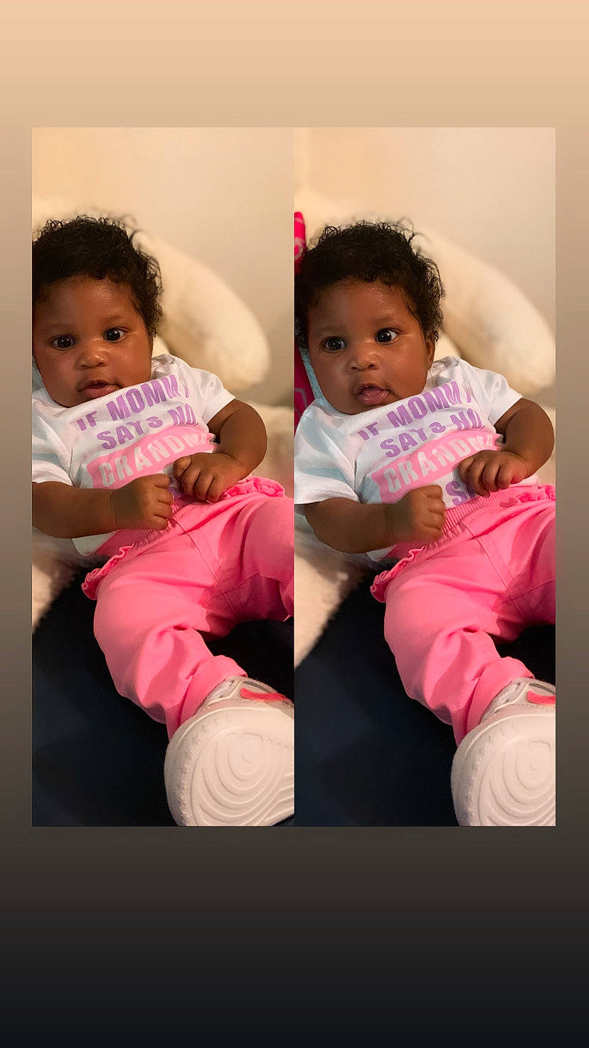 Ashanti is registered to the contest to win money with this photo: arm, baby, baby_toddler_clothing, cheek, comfort, eye, face, facial_expression, flash_photography, gesture, hand, happy, human, human_body, mouth, neck, person, shoulder, skin, sleeve