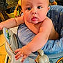 Ryder is registered to the contest to win money with this photo: baby, child, walker, toy, blue_cushion, indoor, curious, chubby_arms, wide_eyes, face, skin, hand, furniture, home, playful, mouse_toy, infant, expression, person, seat