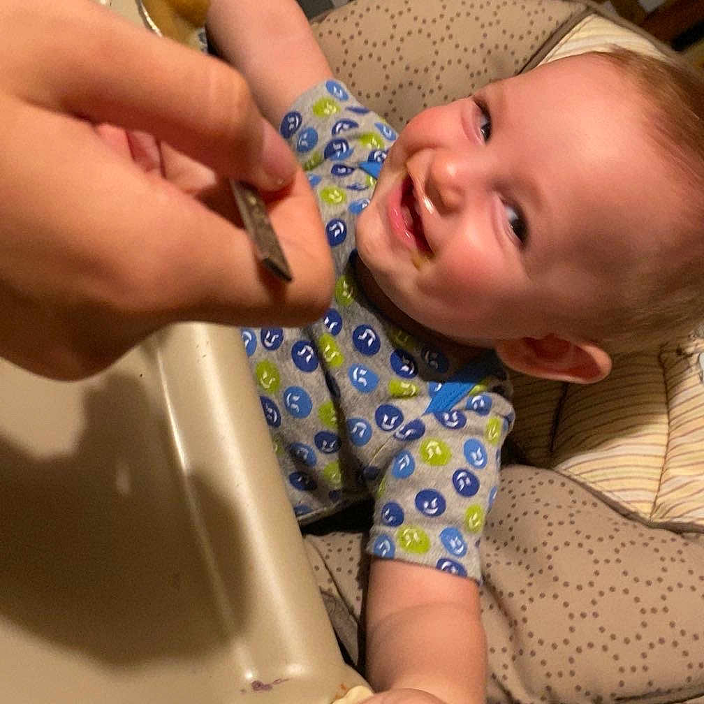 Weylen joined the competition — help win amazing prizes! baby, bodypart, chair, couch, cutlery, face, finger, furniture, hand, happy, head, indoors, laughing, mouth, person, photography, portrait, smile, spoon, teeth