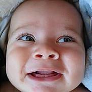 Kawikaonalaniekapu is registered to the contest to win money with this photo: baby, face, closeup, infant, cute, eyes, mouth, skin, expression, blanket, soft, adorable, child, pacifier, portrait, smile, cheeks, newborn, happy, person