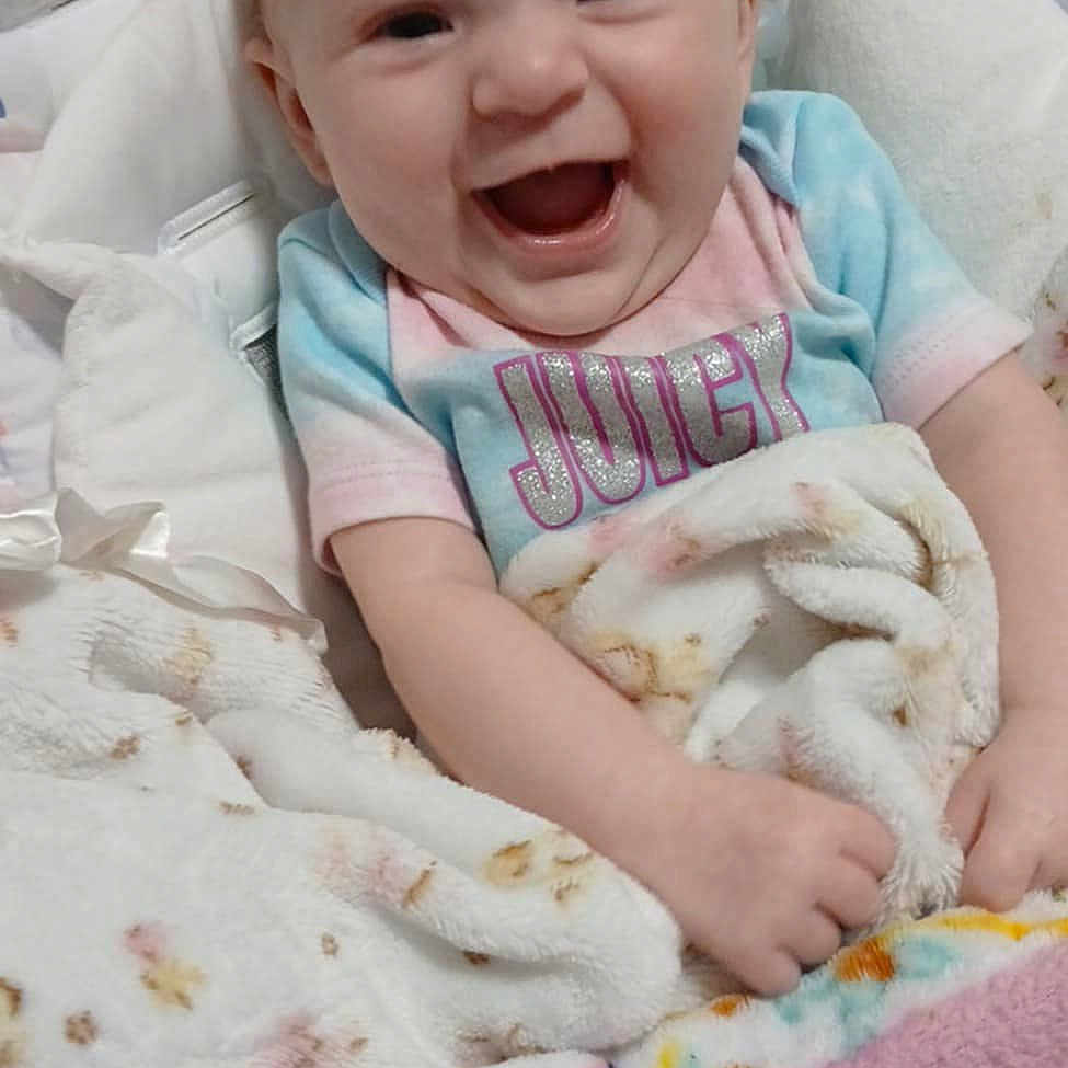 Layn joined the competition — help win amazing prizes! baby, babylaughing, bed, bedroom, blanket, cushion, face, furniture, happy, head, homedecor, indoors, laughing, newborn, person, photography, portrait, quilt, room, smile