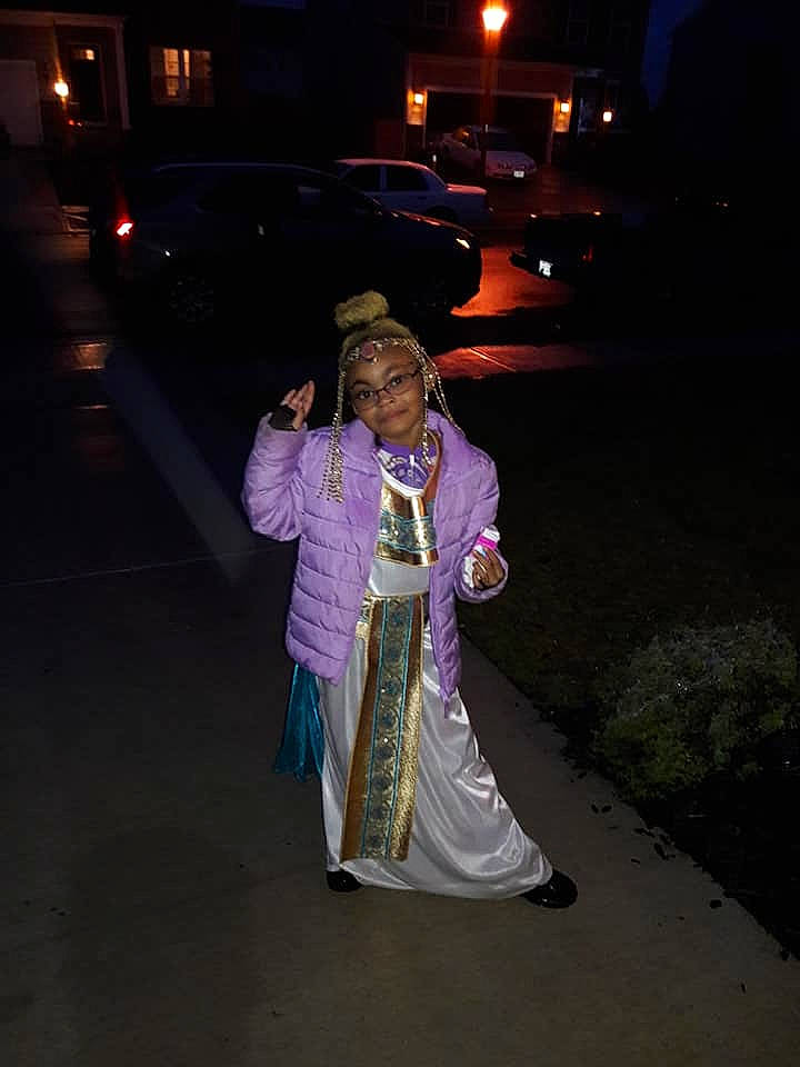 Nia joined the competition — help win amazing prizes! clothing, costume, darkness, dress, event, fun, girl, lighting, midnight, night, person, recreation, tradition