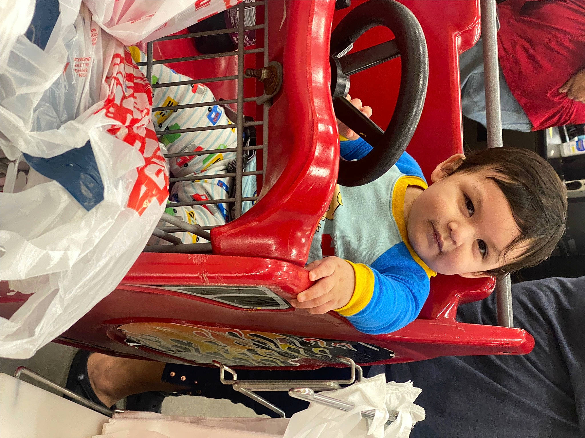 Matthew is registered to the contest to win money with this photo: auto_part, automotive_design, automotive_exterior, automotive_tire, automotive_wheel_system, bumper, electric_blue, fictional_character, fun, leisure, machine, motor_vehicle, person, personal_protective_equipment, recreation, smile, tire, toddler, toy, vehicle