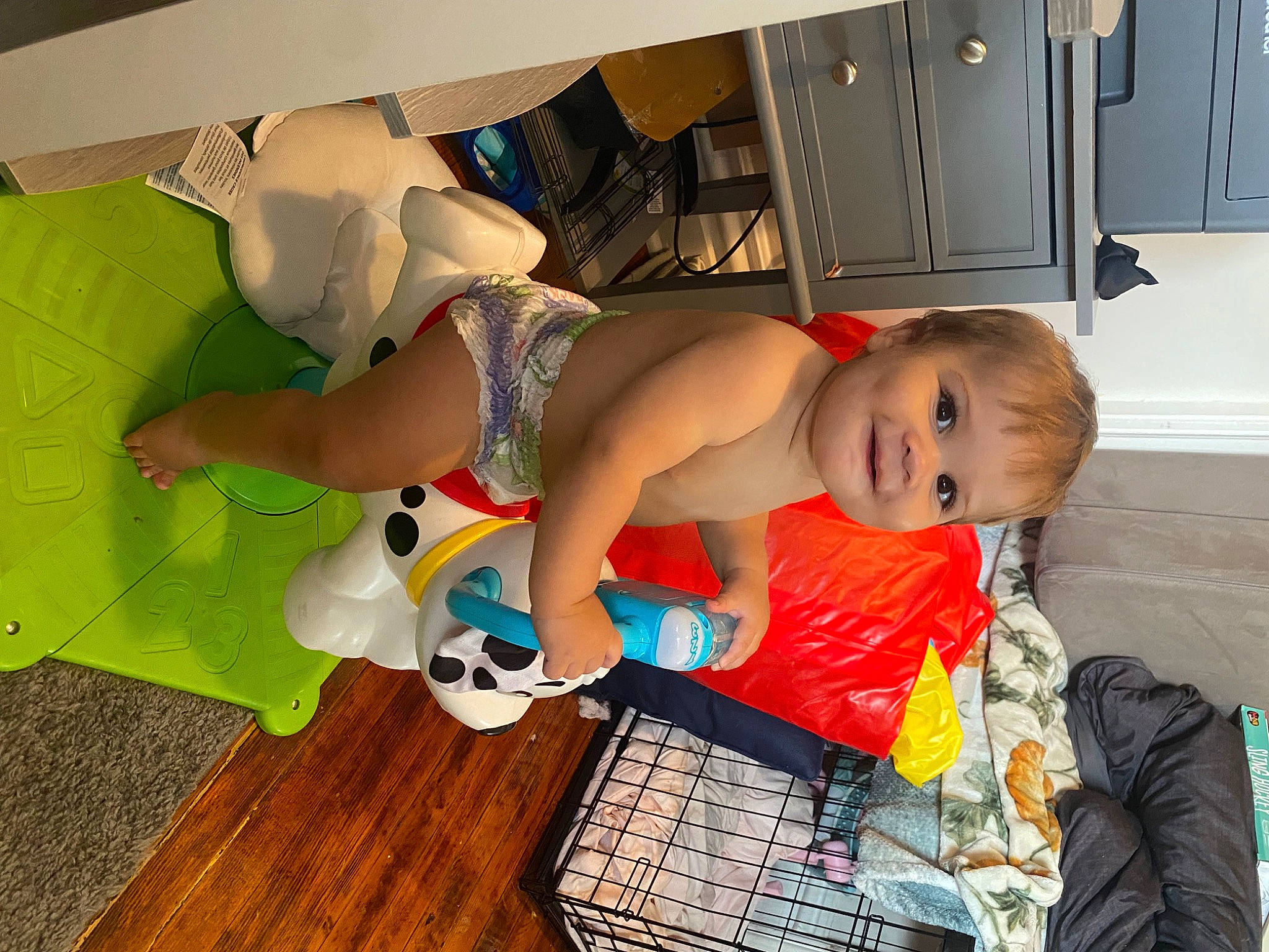 Kamden is registered to the contest to win money with this photo: abdomen, baby, baby_products, backpack, cabinetry, chest, child, cupboard, drawer, flooring, fun, hardwood, home_appliance, joy, kitchen, luggage_and_bags, person, play, room, smile