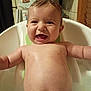 Logan joined the competition — help win amazing prizes! baby, bathtub, bath, smiling, happy, water, indoor, child, skin, kitchen, refrigerator, photo, magnet, home, person, cute, splash, seat, young, expression