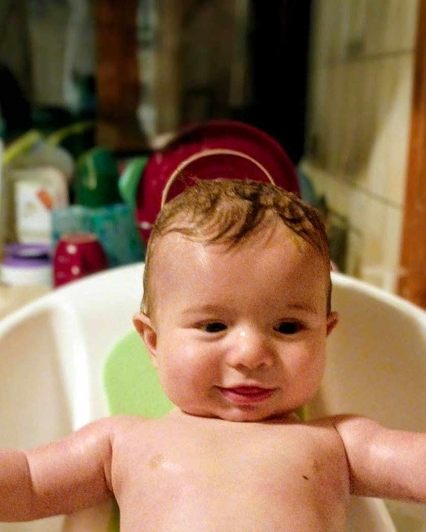 Logan joined the competition — help win amazing prizes! baby, bath, water, skin, smile, face, child, toddler, indoor, bathtub, wet, cute, expression, head, shoulders, person, happy, young, childhood, playful