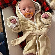 Colton joined the competition — help win amazing prizes! baby, pacifier, bathrobe, infant, blanket, fabric, newborn, cute, sleepwear, soft, child, resting, indoors, person, cloth, comfort, small, human, lying, wrapped