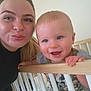 Marley is registered to the contest to win money with this photo: accessories, adult, baby, bed, crib, earring, face, female, furniture, happy, head, indoors, infantbed, jewelry, laughing, person, photography, portrait, railing, woman