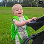 Marley is registered to the contest to win money with this photo: baby, babylaughing, backpack, bag, face, grass, gun, happy, head, laughing, lawn, nature, outdoors, park, person, photography, plant, portrait, stroller, weapon