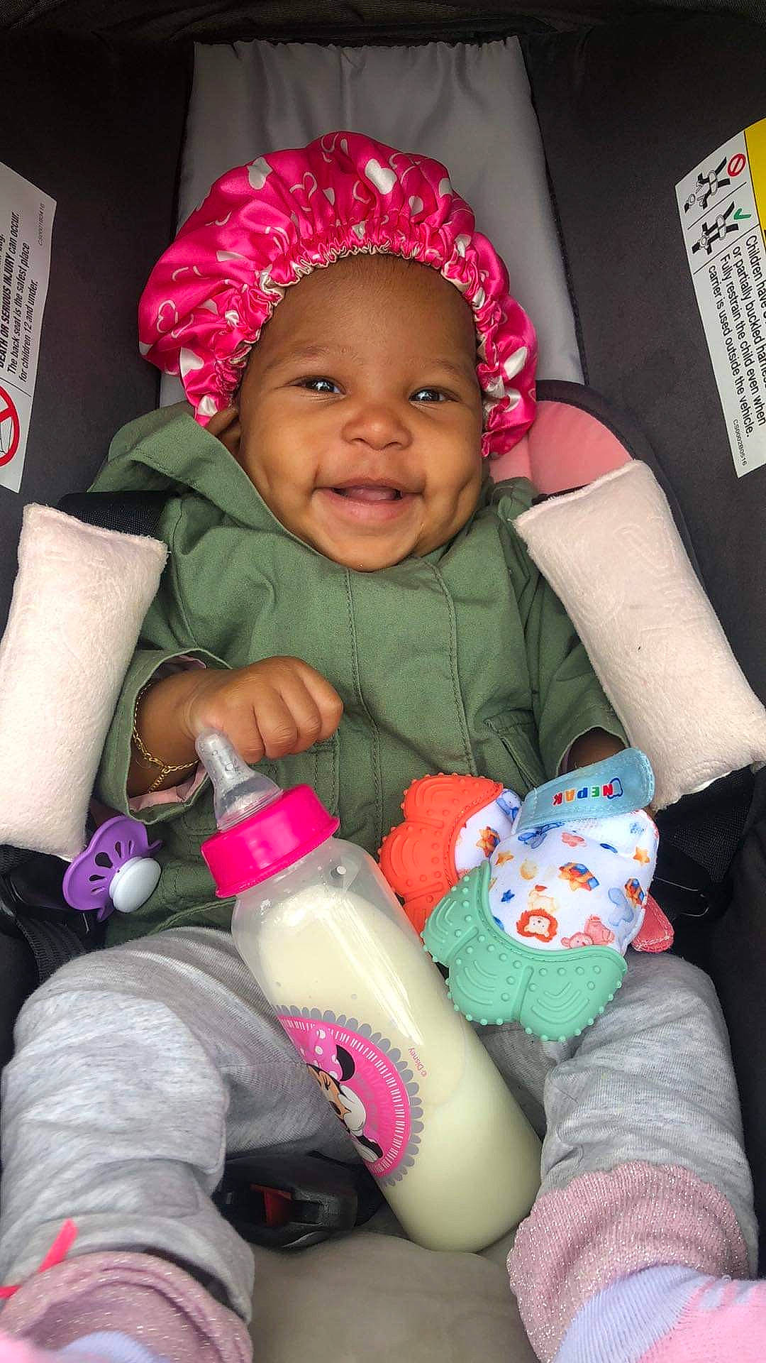 Kailynn is registered to the contest to win money with this photo: baby, baby_toddler_clothing, cheek, eye, face, facial_expression, finger, happy, head, headwear, human, joy, lip, mouth, nose, organ, person, pink, red, skin