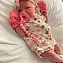 baby, infant, pacifier, mittens, headband, bow, white_bed, pink, clothing, newborn, cute, sleeping, person, lying_down, beaded_clip, soft, portrait, indoors, child, resting