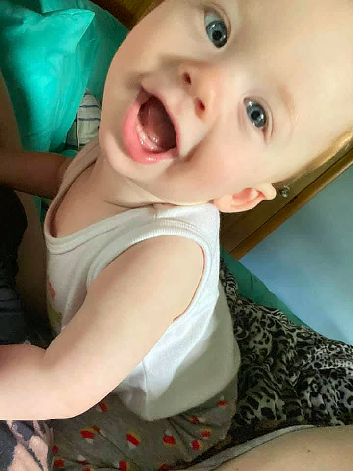 Nico is registered to the contest to win money with this photo: baby_toddler_clothing, cheek, chin, comfort, eye, eyebrow, eyelash, flash_photography, gesture, iris, jaw, lip, mouth, neck, nose, organ, person, skin, sleeve, smile