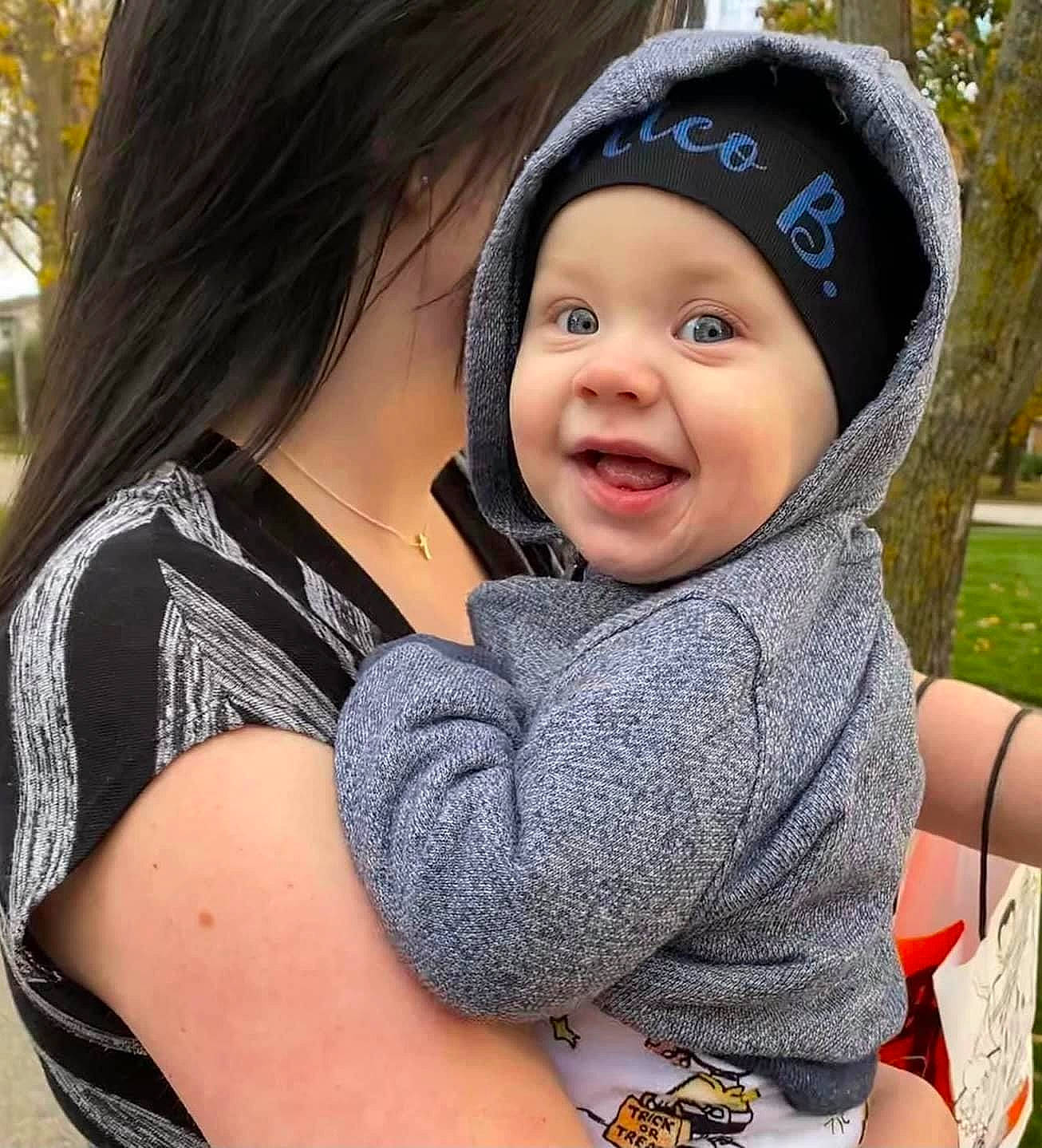 Nico joined the competition — help win amazing prizes! arm, baby, baby_toddler_clothing, cap, cool, facial_expression, gesture, grass, happy, hat, headwear, interaction, lip, organ, outerwear, people, person, skin, sleeve, smile