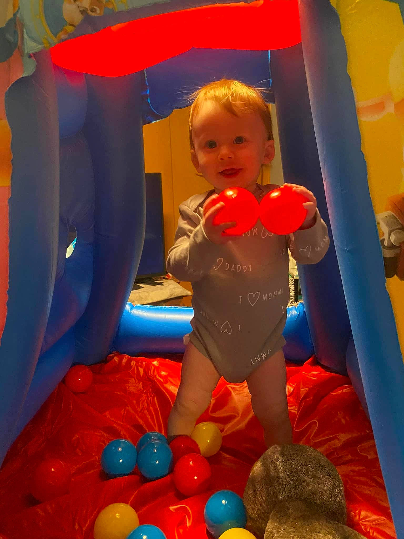 Nico is registered to the contest to win money with this photo: arm, ball_pit, beauty, child, chute, electric_blue, fun, human_settlement, inflatable, leisure, outdoor_play_equipment, party_supply, person, photograph, play, playground, product, recreation, red, snapshot
