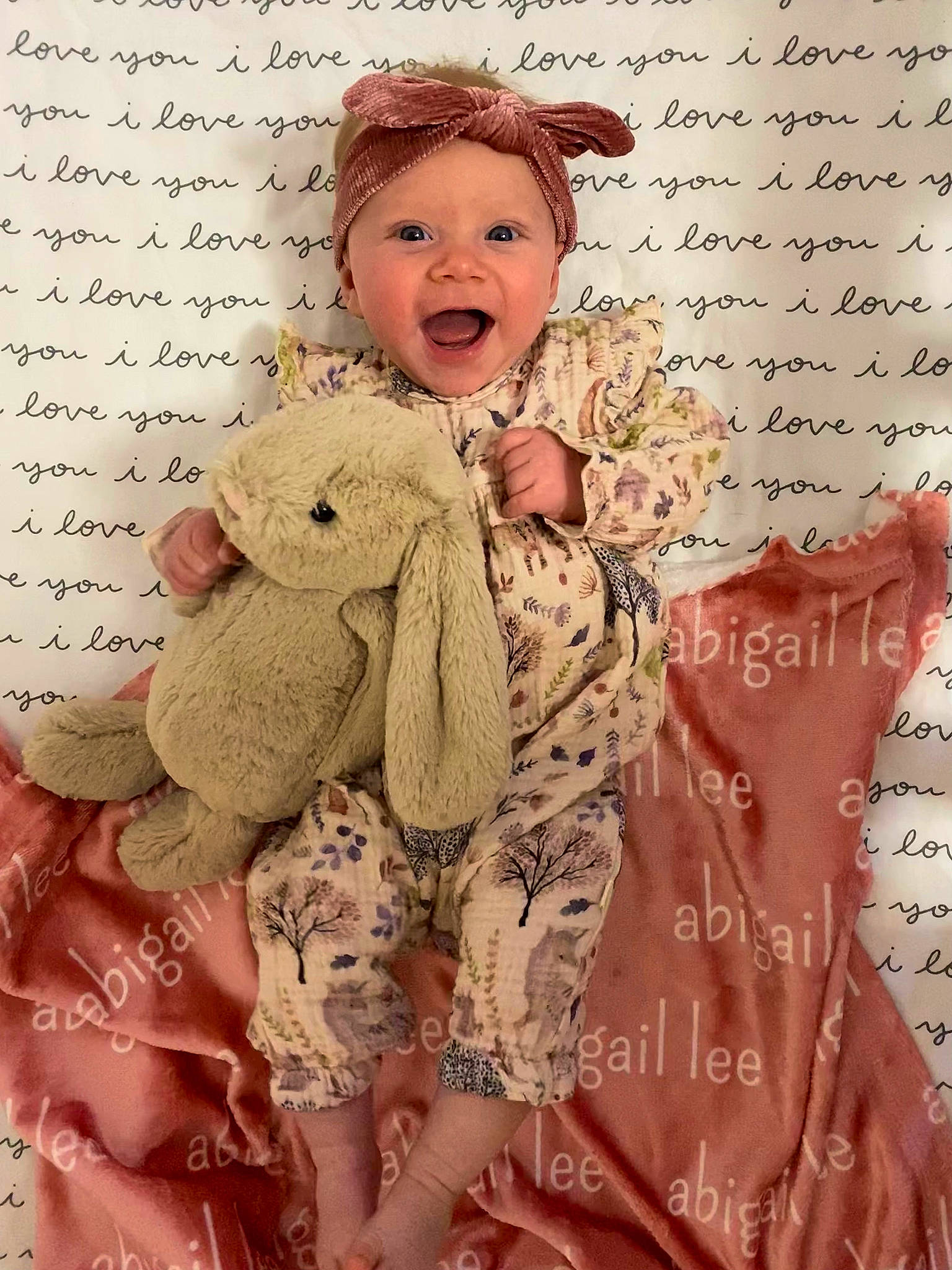 Abigail is registered to the contest to win money with this photo: art, baby_toddler_clothing, cheek, eye, fashion_design, font, handwriting, happy, hat, head, human_body, pattern, person, pink, skin, sleeve, smile, textile, toddler, toy