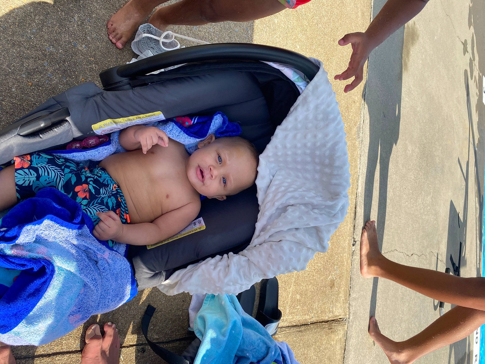 Tony is registered to the contest to win money with this photo: baby, baby_carriage, baby_products, baby_toddler_clothing, blue, child, comfort, electric_blue, fun, grass, happy, hat, leisure, person, sitting, thigh, toddler, tree, vacation