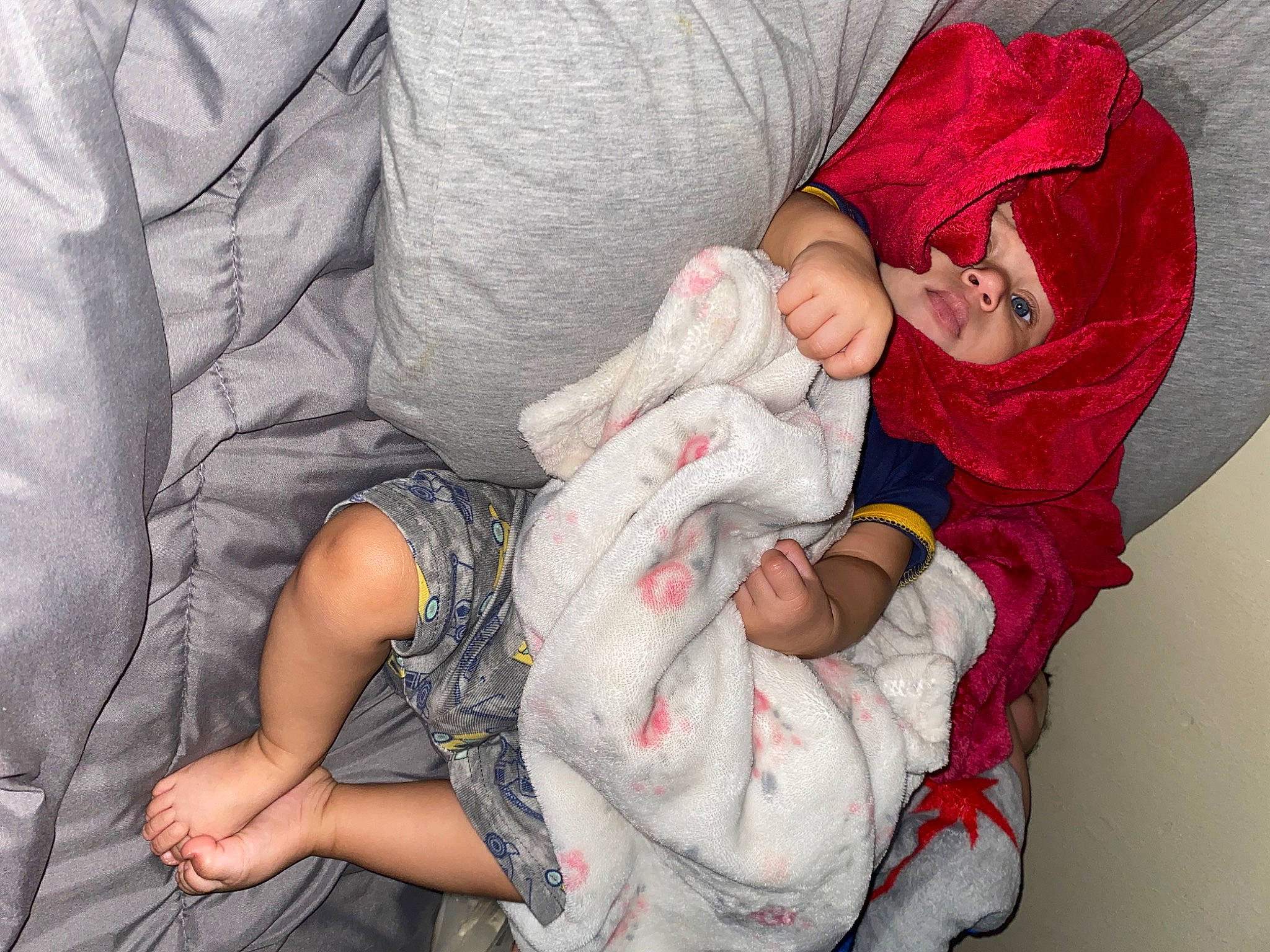 Tony is registered to the contest to win money with this photo: arm, baby, baby_sleeping, baby_toddler_clothing, cheek, comfort, eye, finger, gesture, hand, headwear, human_body, joint, leg, mouth, nail, person, skin, sleeve, textile