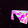 animal, broadcast, cat, colorful, contrast, dark_room, electronics, entertainment, feline, furniture, home, indoor, living_room, night, people_on_tv, screen, seated, shadow, silhouette, television