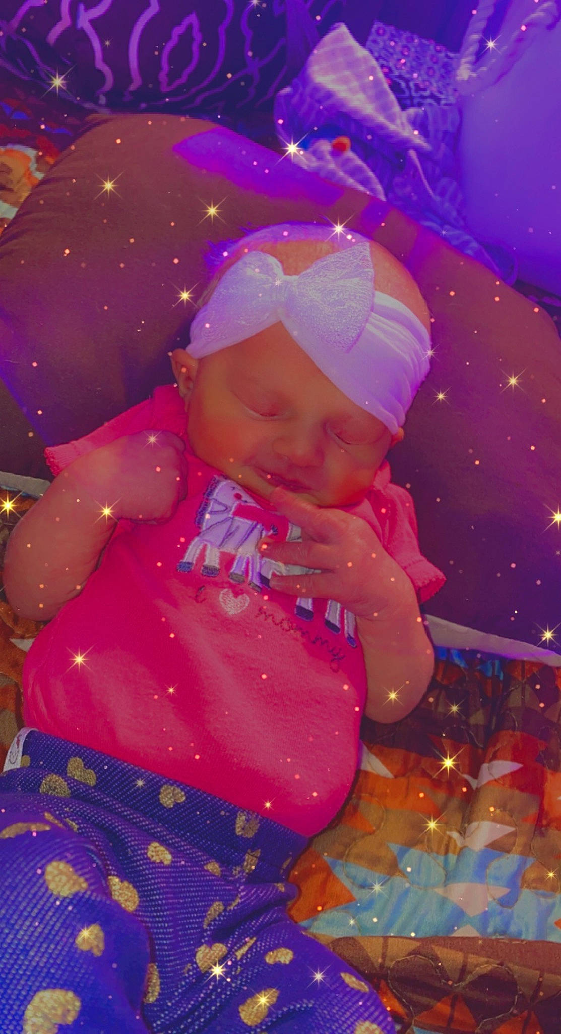 Ariel is registered to the contest to win money with this photo: baby_toddler_clothing, child, christmas, christmas_decoration, christmas_eve, christmas_ornament, event, fun, happy, headwear, holiday, magenta, ornament, party_supply, people, person, pink, purple, red, toddler