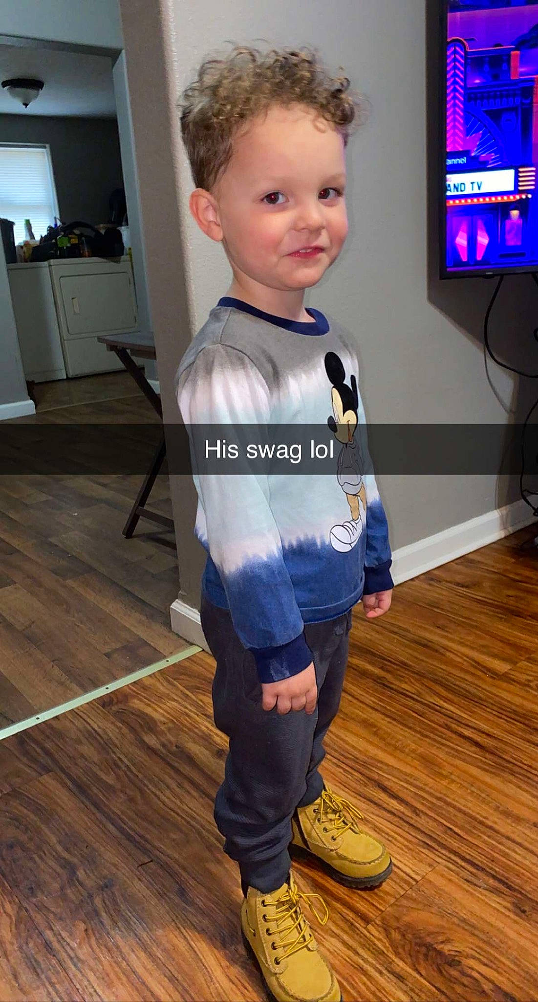 Braxton joined the competition — help win amazing prizes! child, denim, electric_blue, eye, face, fashion_design, flooring, hardwood, home_appliance, laminate_flooring, person, sleeve, smile, sportswear, standing, t_shirt, television, toddler, varnish, wood