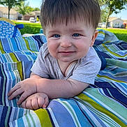 Owen joined the competition — help win amazing prizes! baby, child, blue_eyes, smile, outdoor, blanket, striped, grass, toddler, curly_hair, cute, sunny, portrait, person, nature, daylight, hand, face, clothing, neighborhood