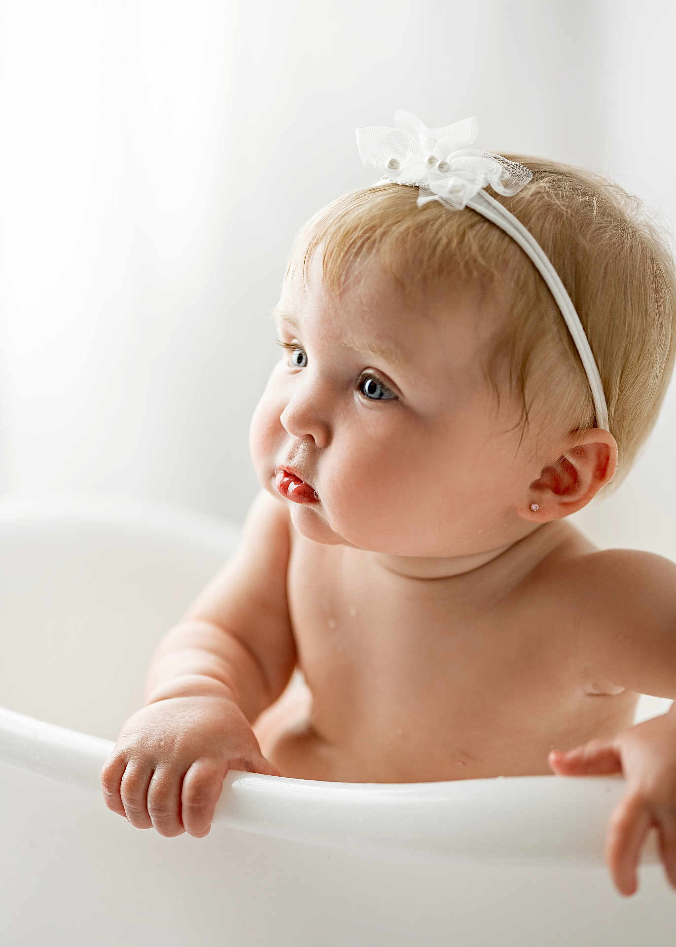 Anastasia joined the competition — help win amazing prizes! baby, infant, toddler, child, bathtub, bath, headband, white, skin, hand, face, earring, blue_eyes, portrait, cute, soft_light, water_drops, expression, indoors, closeup