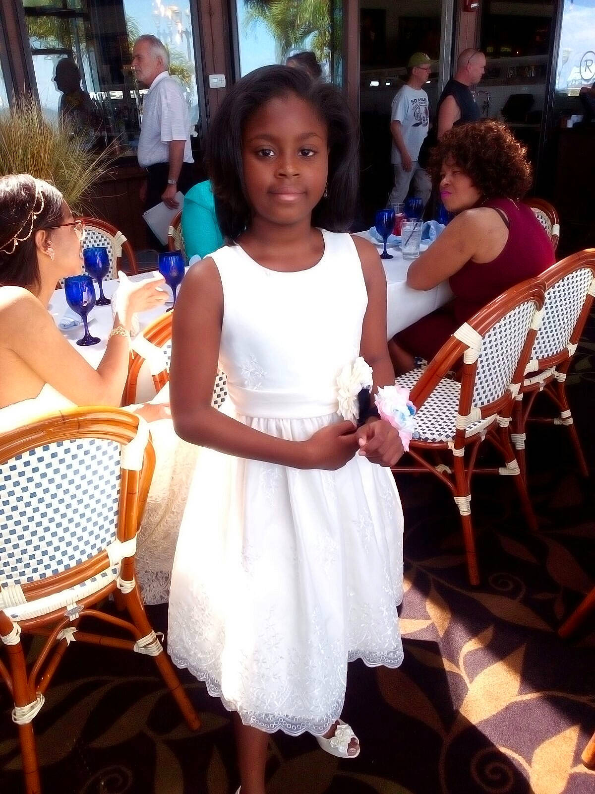 Camille is registered to the contest to win money with this photo: ceremony, child, dress, event, fashion, joy, leisure, party, person, vacation, white