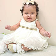 Luna joined the competition — help win amazing prizes! baby, child, dress, white_dress, bow, ponytail, cute, smiling, sitting, indoors, sock, baby_socks, adorable, chubby_cheeks, portrait, happy, young_child, fashion, elegant, infant