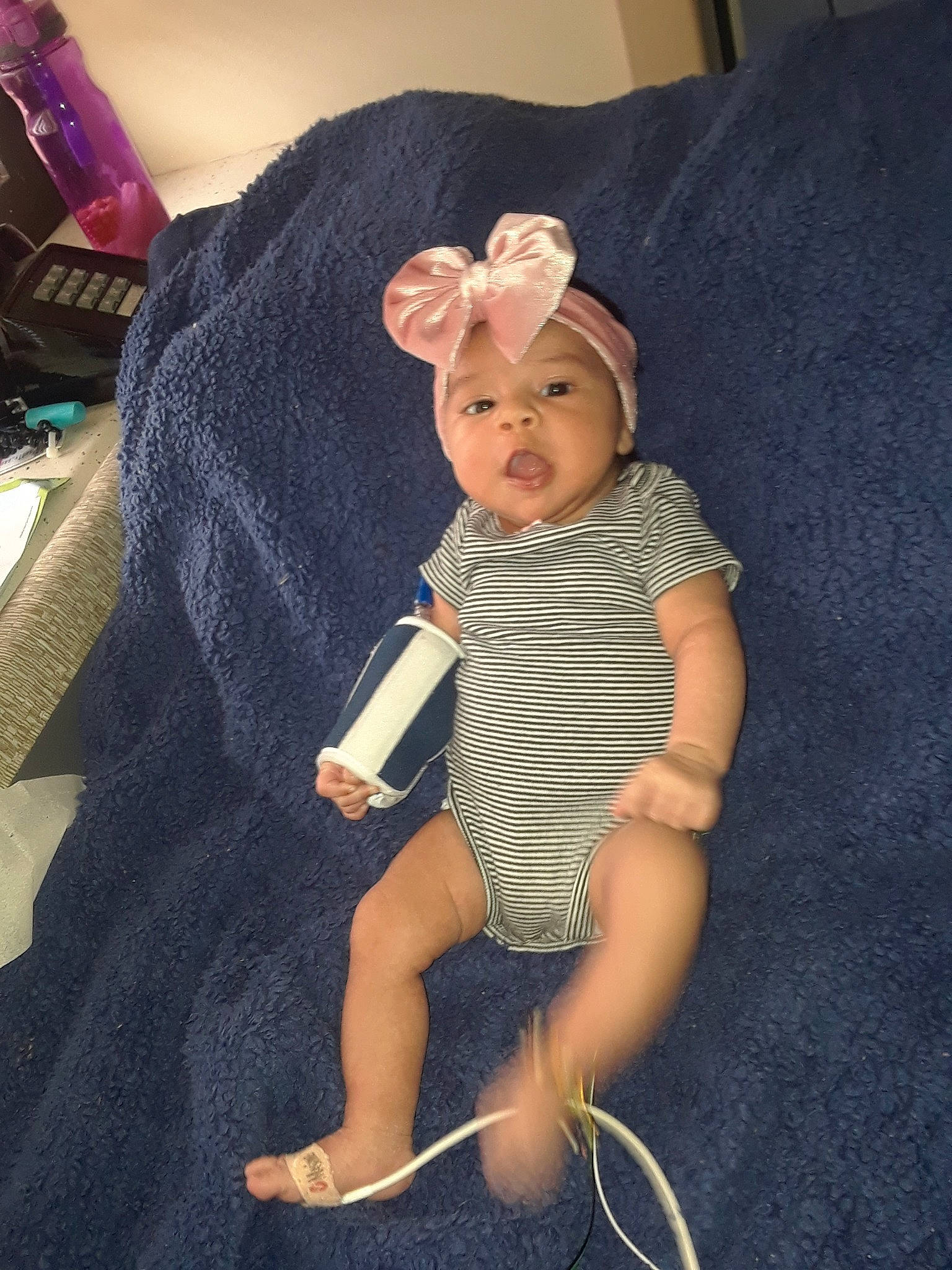 Roxanna is registered to the contest to win money with this photo: arm, baby, child, leg, person, sitting, toddler, toy